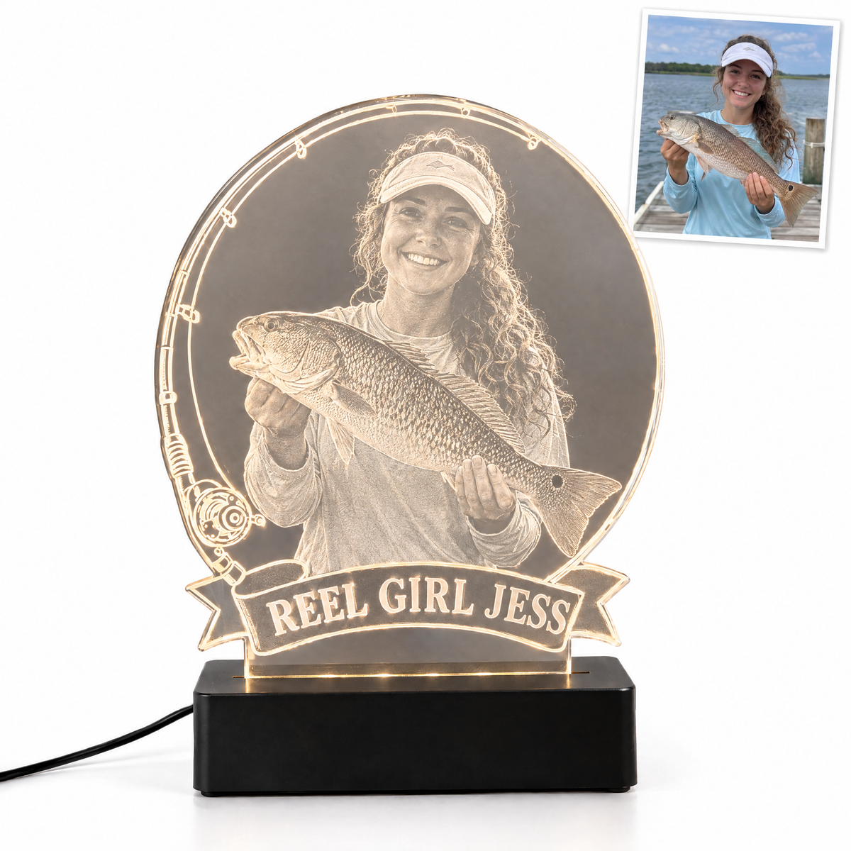 Woman angler with redfish engraved LED light, banner REEL GIRL JESS