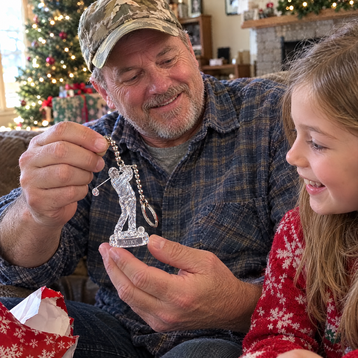 Grandpa shows the crystal-style golf keychain to his granddaughter at Christmas