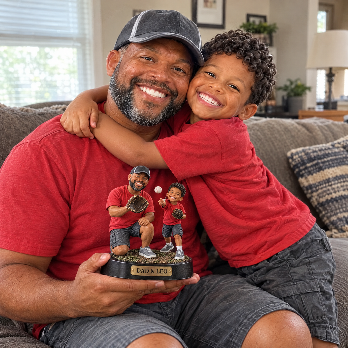 The son gives his dad the father and son baseball figurine on Father's Day