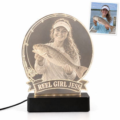 Woman angler with redfish engraved LED light, banner REEL GIRL JESS