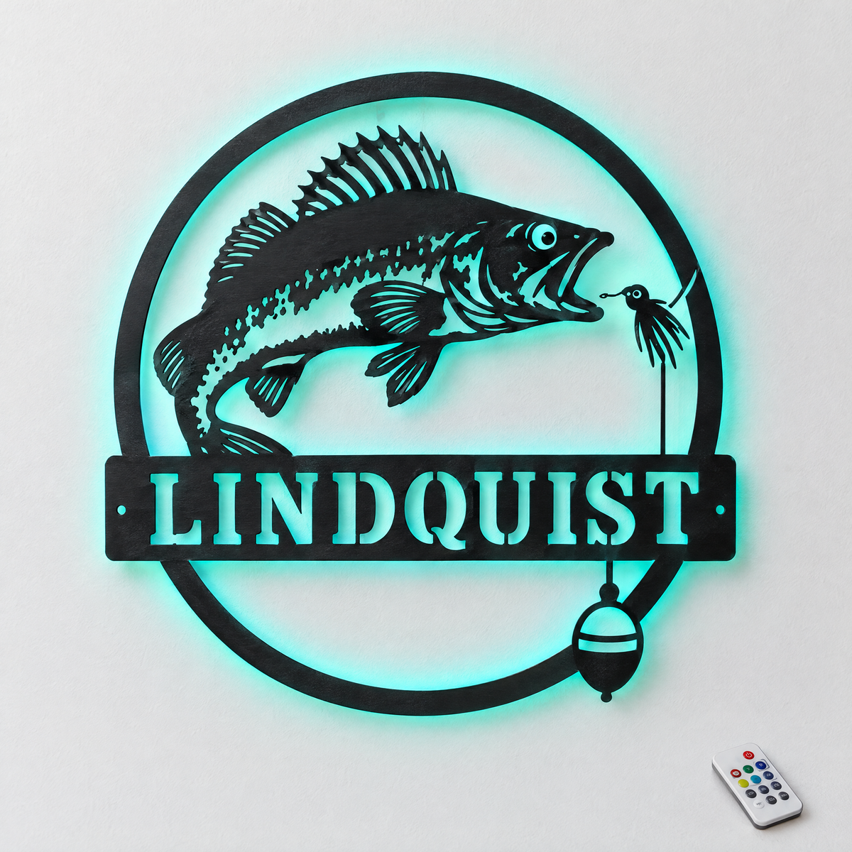 Custom round walleye metal name sign LINDQUIST with teal LED backlight