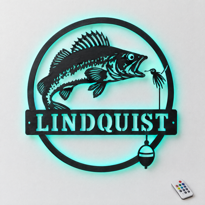 Custom round walleye metal name sign LINDQUIST with teal LED backlight