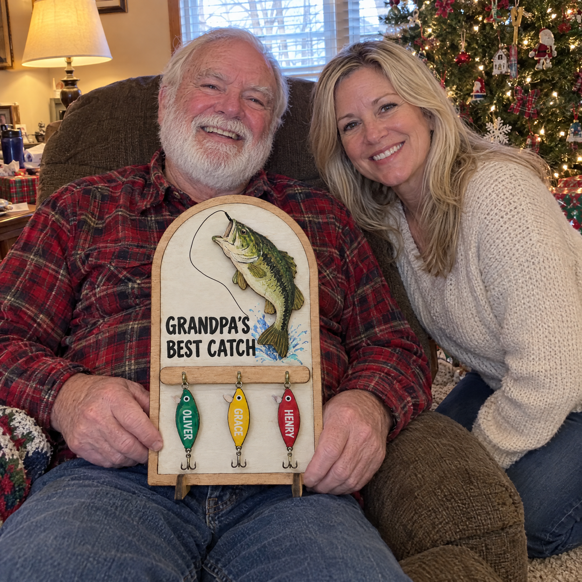 Grandpa with daughter holding GRANDPA'S BEST CATCH sign at Christmas