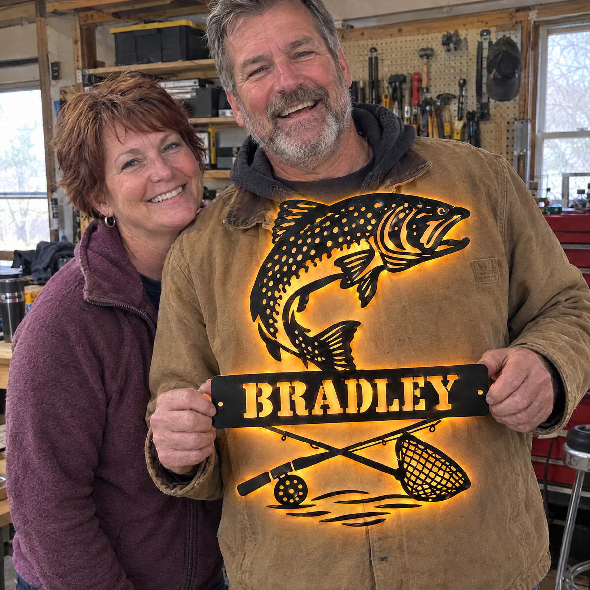 Wife surprises husband with lit salmon name sign in his workshop
