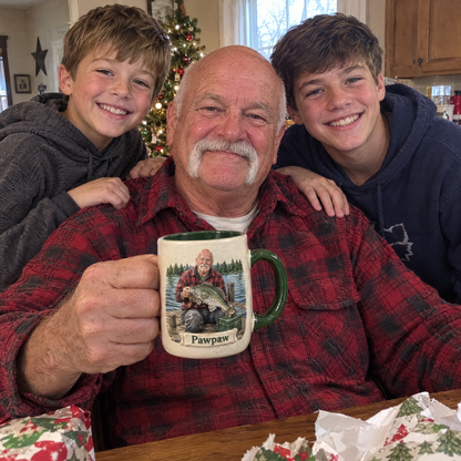 Grandpa with Pawpaw fishing mug and grandsons at Christmas