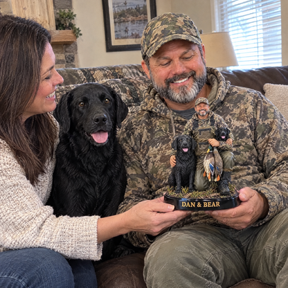 Wife gives husband hunter and dog figurine with the real Lab beside him