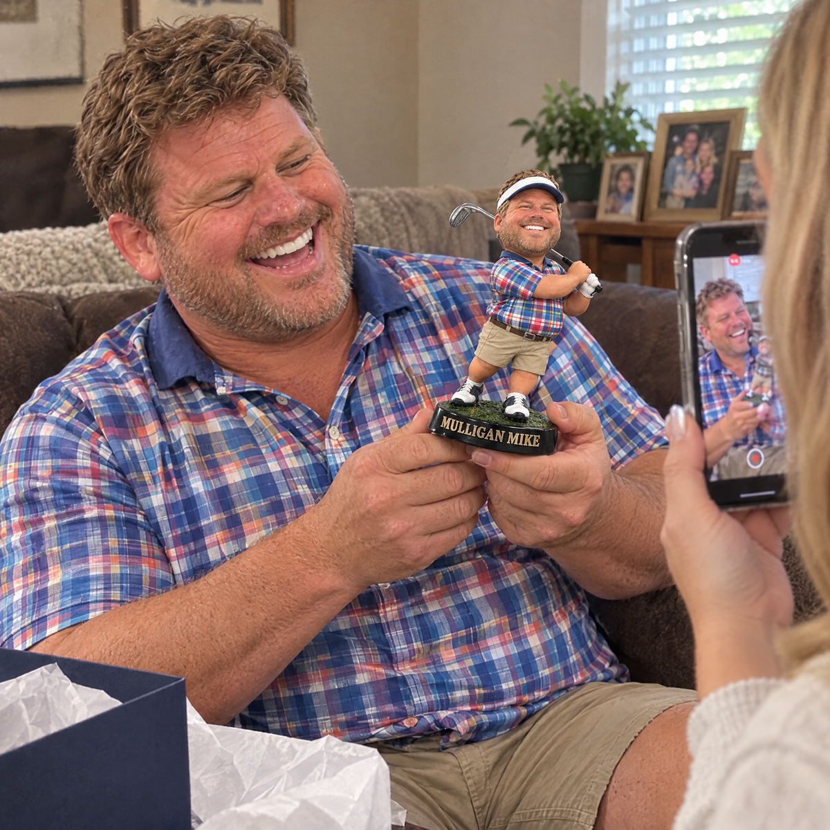 His wife films him laughing at the funny golfer figurine on his birthday