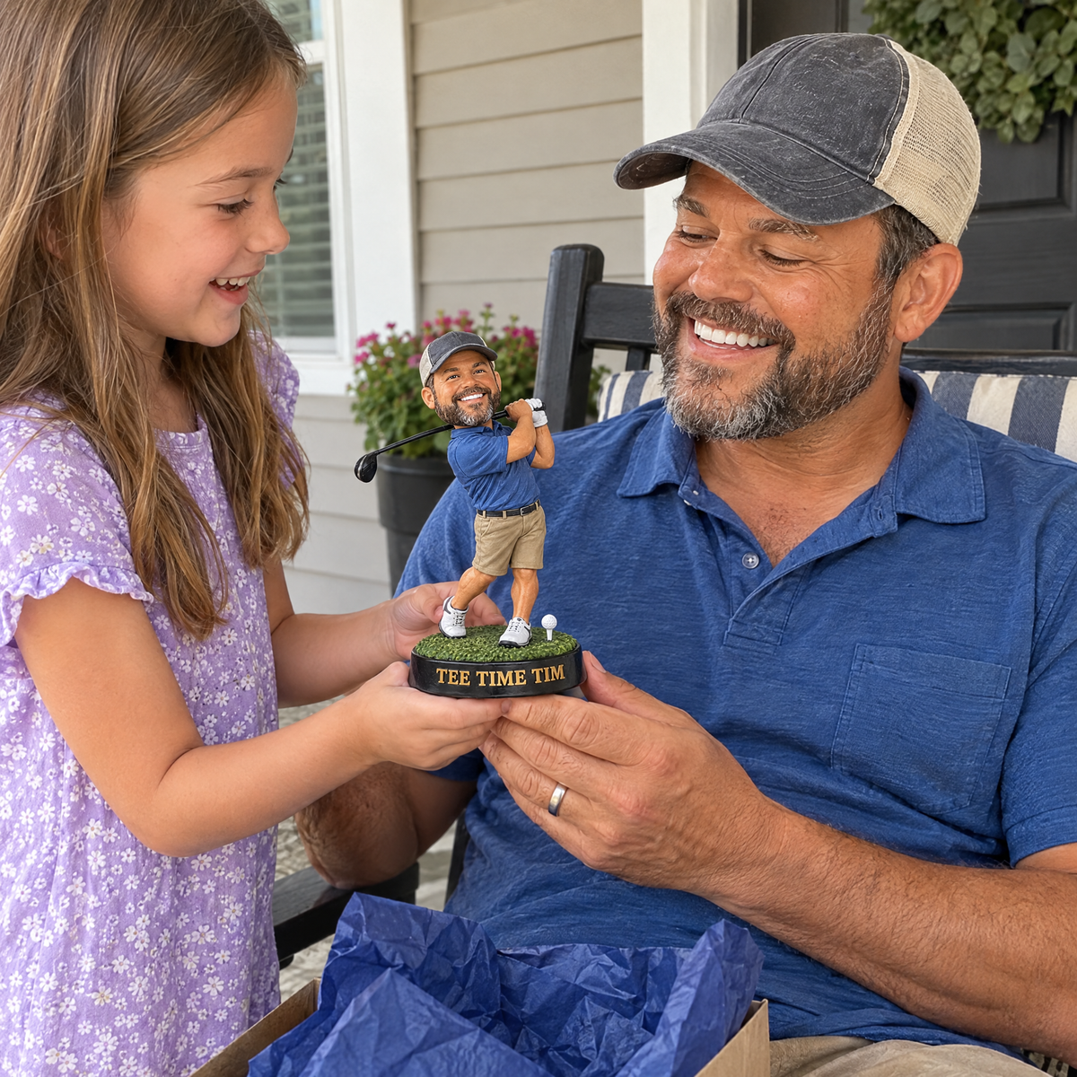 His daughter gives him the caricature golf figurine on Father's Day on the porch