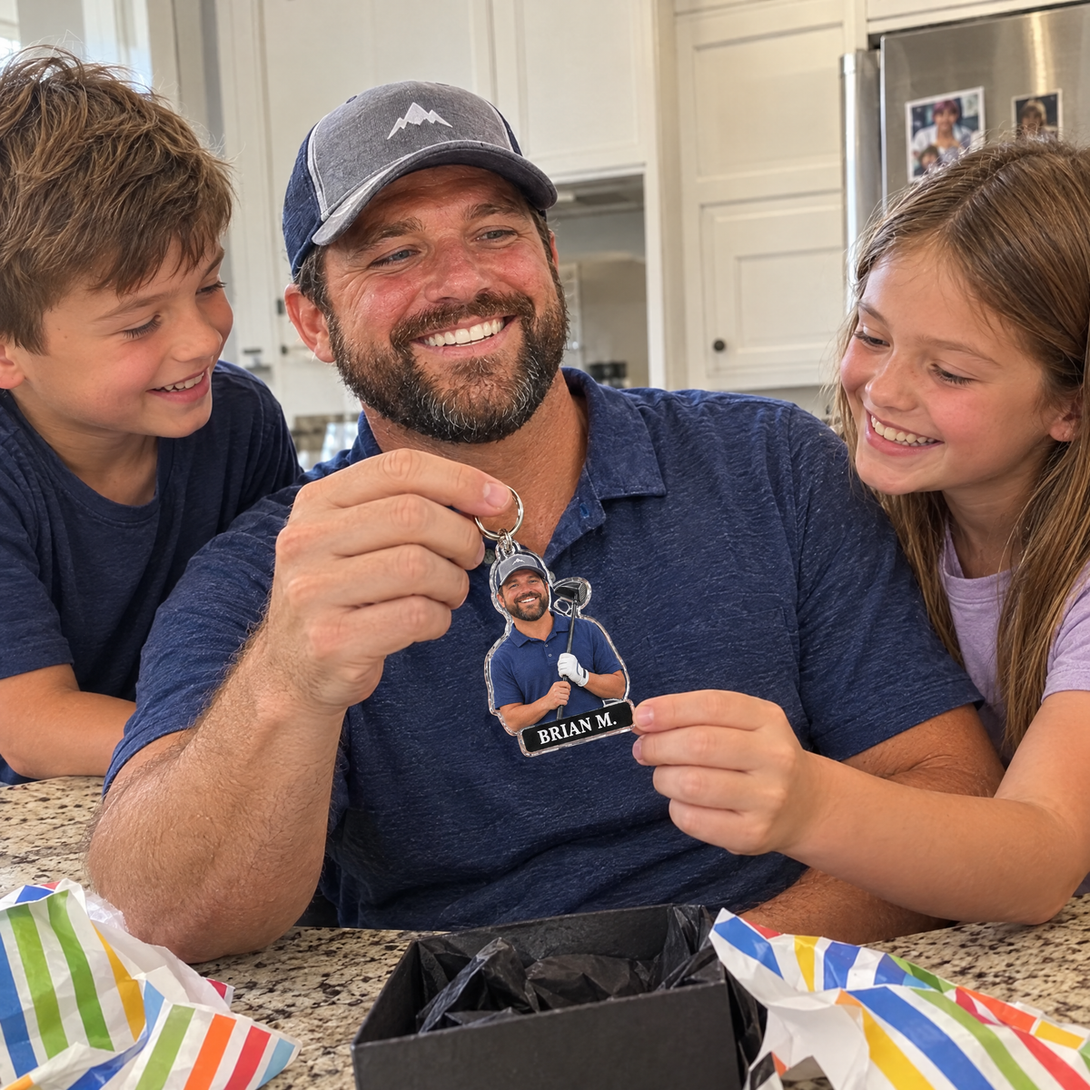 His kids give him the golf bag tag keychain on his birthday at the kitchen counter