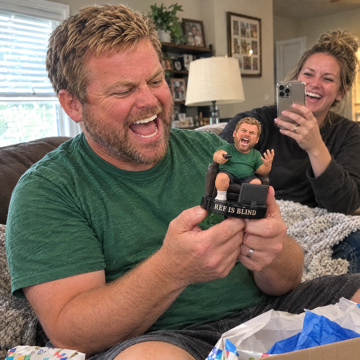 His wife films him laughing at the funny football dad figurine on his birthday