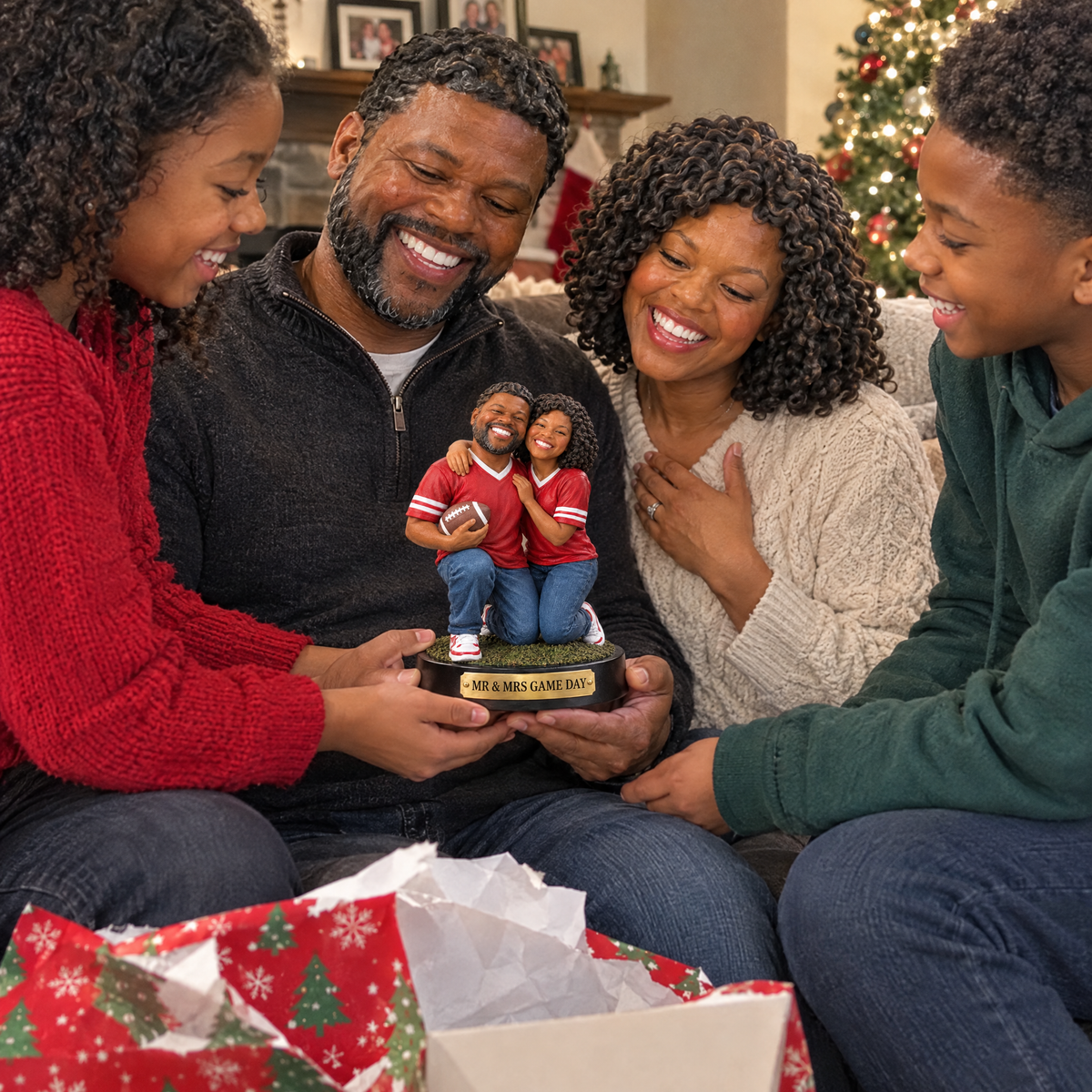 Their kids give the football couple figurine to their parents at Christmas