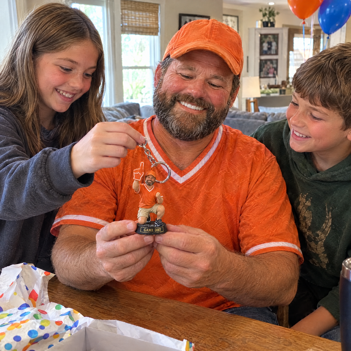 His kids give him the football fan keychain on his birthday