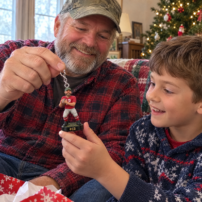 Grandpa shows the football player keychain to his grandson at Christmas