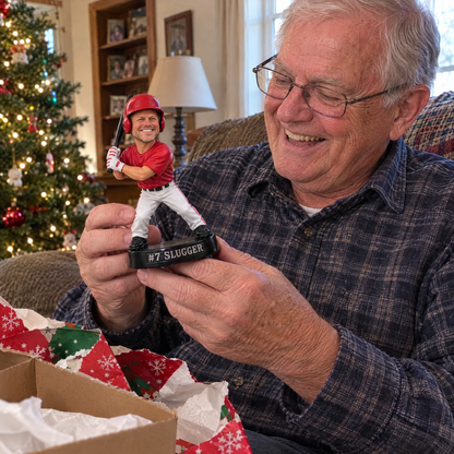 Grandpa unwraps the baseball batter figurine at Christmas