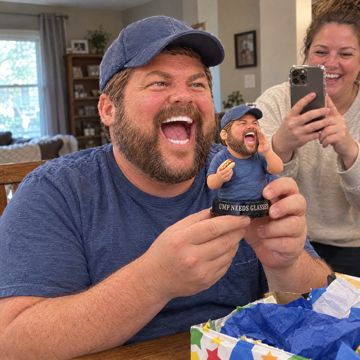 His wife films him laughing at the funny baseball dad figurine on his birthday