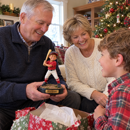 Grandparents give the Little League figurine to their grandson at Christmas