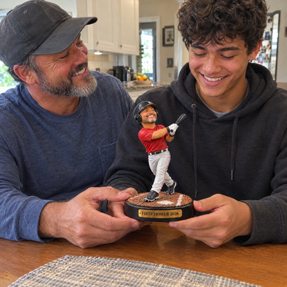 His dad gives him the home run trophy figurine at the kitchen table
