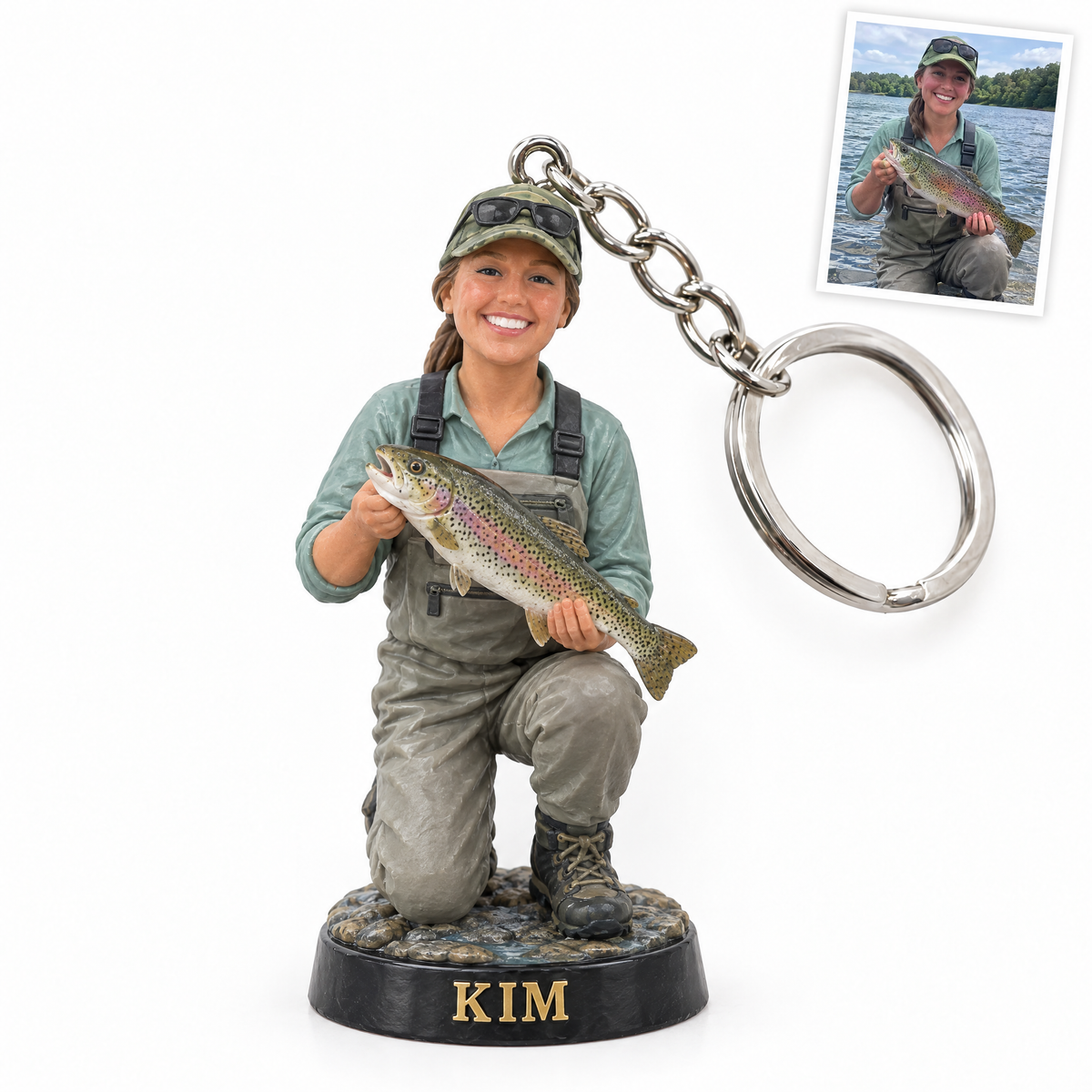 Figurine keychain of woman angler in waders with rainbow trout