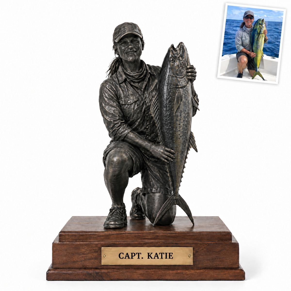 Black metal statue of woman angler with mahi-mahi, CAPT. KATIE plate