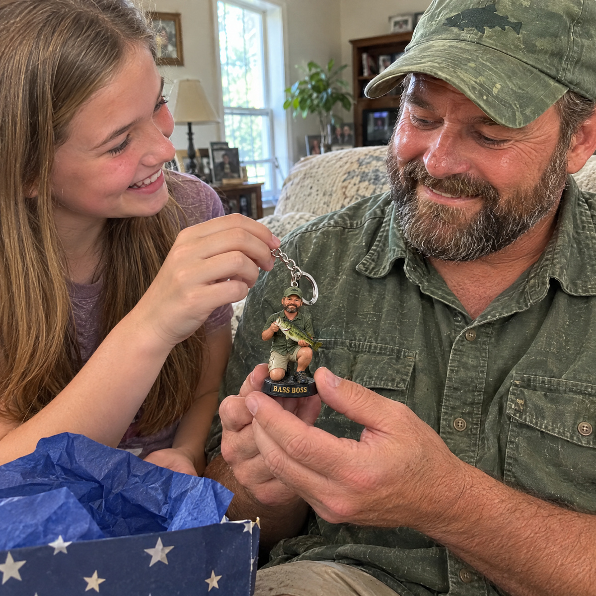 Dad shows his fishing figurine keychain from daughter on Father's Day