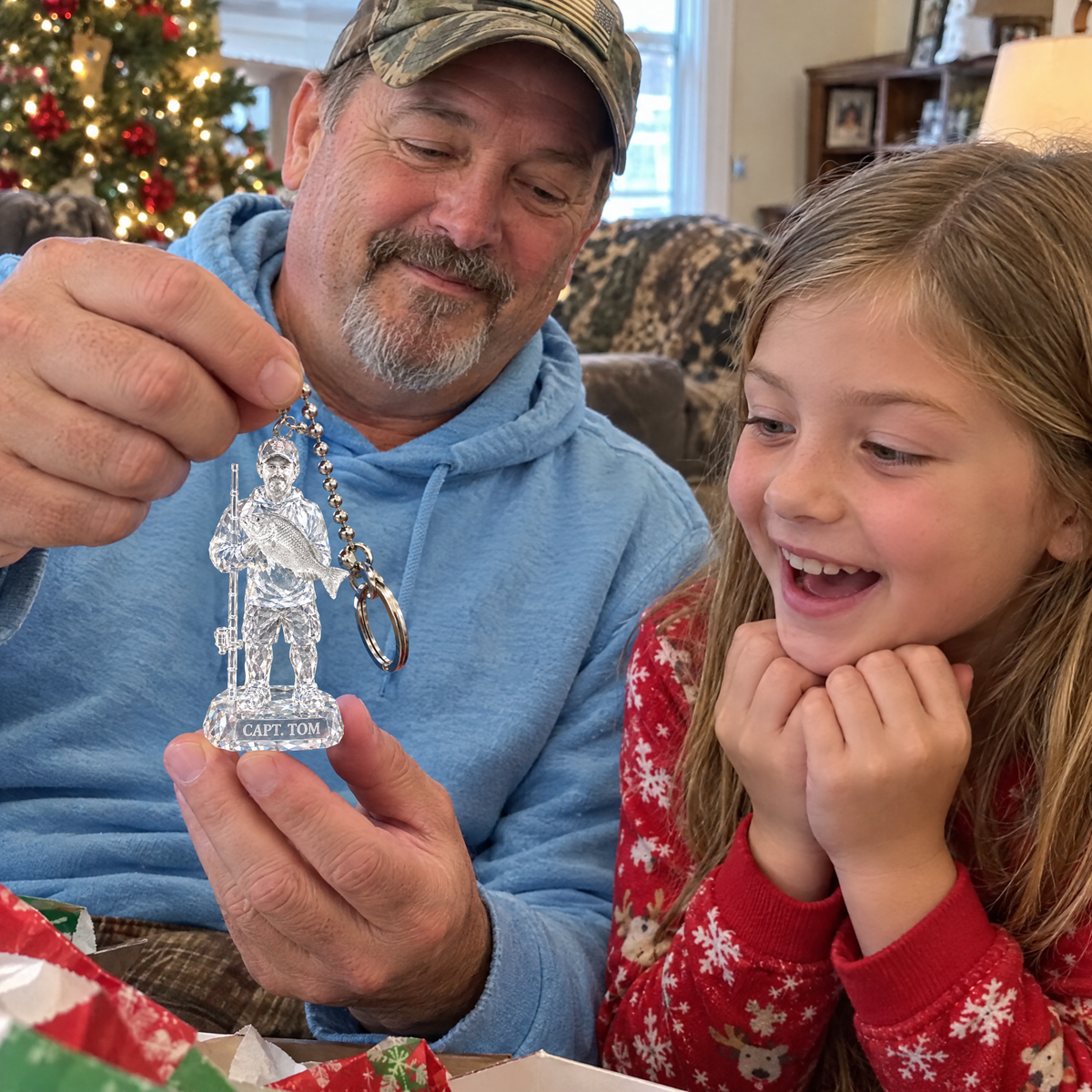 Grandpa shows crystal fishing keychain to granddaughter at Christmas